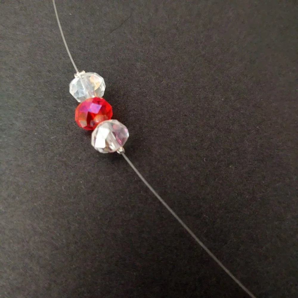 Floating clear and orange crystal necklace